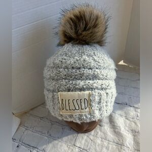 RAE DUNN GREY WITH POM POM BEANIE WITH BLESSED WHITE LOGO FAUX FUR ONE SIZE